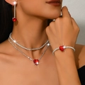 Sparkling silver jewelry set with red heart stones and diamond chains on a female model - 3-Piece Set (1514) / Red