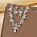 Macro shot of bridal silver necklace set with teardrop crystals and floral leaves detail - Silver (1422)