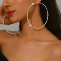 Sparkly 8cm silver oversized hoop earrings with full rhinestones on female model - Silver (Size 10)