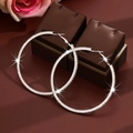 Close-up of 8cm silver oversized hoop earrings with sparkling crystals on jewelry box - Silver (Size 7)