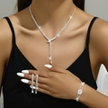 Sparkling zircon bridal jewelry set with fringe necklace and drop earrings on model - Necklace, Earrings and Bracelet / Silver