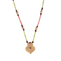Detailed macro view of 18k gold tarot eye pendant with blue zircon and ethnic cord - Green Rope Heart Necklace
