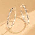 Detailed view of large silver hoop earrings with sparkling pavé-set round zircons - Silver (Size 5)