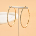 Elegant gold-tone large hoop earrings with sparkling pave-set cubic zirconia crystals - Gold (Size 8)