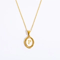 Detailed close-up of gold-plated oval pendant with letter P on white inlay and link chain - Letter P / Gold