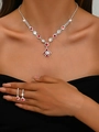Detailed close-up of bridal jewelry set with red crystals and shimmering rhinestones - 709 Red