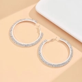 Detailed view of silver hoop earrings with three rows of sparkling white rhinestones - L Size (6cm) / Silver