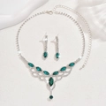 Detailed close-up of emerald green jewelry set with water drop rhinestones and silver base - 1341 Green