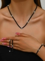 Detail shot of black rhinestone jewelry set including tennis necklace, bracelet and earrings - Necklace + Earrings + Bracelet / Black (3-Piece Set)