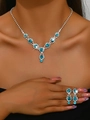 Close-up of silver bridal jewelry set with sky blue crystals on elegant female model - Sea Blue Necklace And Earrings