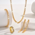 Sparkling gold jewelry set with necklace, bracelet, ring, and earrings on white pedestals - Necklace + Earrings + Bracelet + Ring / Gold (4-Piece Set)