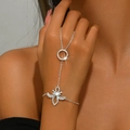 Elegant silver butterfly ring bracelet with rhinestones on a female hand - Butterfly Rhinestone Style (1489) / Silver