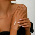 Elegant silver finger bracelet with three sparkling zircons on a model's hand - Triple Rhinestone Style (1501) / Silver