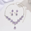 Detail view of purple crystal bridal jewelry set with necklace and earrings on silk background - Necklace and Earring Set / Purple