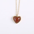 Elegant gold heart necklace with dark red carnelian pendant on a clean white background - Gold Stainless Steel / Red Agate Gold Necklace
