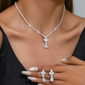 Close-up of model wearing silver zircon teardrop necklace and matching earrings set - 1261 Silver