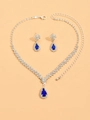 Silver bridal jewelry set with V-shaped rhinestone necklace and blue teardrop gems - Sapphire Blue Necklace Earrings