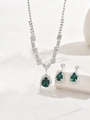 Detail of silver emerald green pear-cut necklace and earrings jewelry set on stone - 695 Green