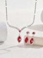 Macro view of bridal V-shaped necklace and drop earrings with red gems and rhinestones - Red