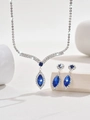 Detailed view of silver necklace and teardrop earrings set with royal blue marquise stones - Sapphire Blue