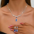 Elegant silver V-shaped necklace and earrings set with deep blue marquise gemstones - 1349 Blue