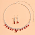 Detail view of necklace and earrings set with red pear-cut stones and white crystals - 927 Red