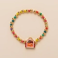 Detailed macro view of children's rainbow beaded bracelet with a pink BFF backpack charm - BFF Style / School Bag