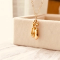 Exquisite gold ballet shoes pendant necklace with a ribbon bow on a dainty chain - Gold