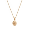 Detail of vintage oval gold locket necklace with floral relief and pink gemstone - October