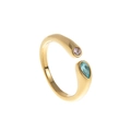 Detailed macro view of 18k gold-plated open ring with pink and blue crystal birthstones - March