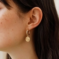 Golden hoop earrings with textured spiral croissant pendant shown on a model profile - Raisin Bread Style (Earrings) (5892431434311)
