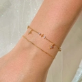 Zweilagiges goldenes Edelstahl-Fußkettchen mit Achtzackstern-Anhängern und Zirkonias - Armband / Gold