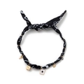 Detail of printed fabric necklace with gold key, dice, card, and evil eye charms - Clover-Black
