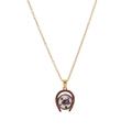 Close-up of vintage golden necklace with horseshoe pendant and painted floral ceramic charm - Printed U-Shape Necklace