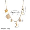 Tropical ocean style pearl necklace with butterfly, shell and heart charms in gold finish - Pearl Cactus Boot Necklace