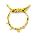 Detail of yellow paisley fabric necklace featuring gold Good Luck and evil eye charms - Dice - Yellow
