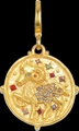 Gold Aries zodiac pendant with ram relief and colorful crystals on black background - Aries