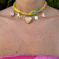 Colorful silk ribbon choker with 18k gold-plated heart and butterfly pendants on model - Heart Butterfly Style