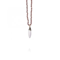 Detailed macro view of deep purple gemstone beads and a white cone pendant with gold plating - White Chili Pendant / White