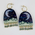 Detail of celestial moon and mountain arch earrings with green beaded fringe - Half Oval Purple Style