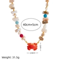 Bohemian ocean shell necklace with red crab pendant and colorful beaded starfish elements - Crab