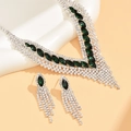 Macro shot of silver bridal necklace and earrings set with green stones and rhinestones - Peacock Green (909)