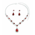 Macro shot of silver plated jewelry set with red teardrop crystals and clear zircon accents - Red