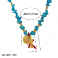 Collier de style ethnique avec pierres turquoise et pendentif poisson doré et corail - Collier de Perles Bleues
