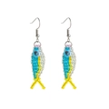 Close-up of handmade beaded fish earrings with blue and yellow beads and silver hooks - Blue and Yellow Fish Earrings