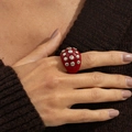 Macro shot of bold red resin punk ring with silver metal studs worn on hand - Rivet Ring / Red (0978)