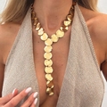 Close-up of golden Y-shaped tassel necklace with hammered disc texture on model - 02 Hammered Disc Y-Necklace (7609) / Gold