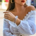 Close-up of translucent chunky acrylic bangle on wrist with elegant white lace outfit - Transparent (2252)