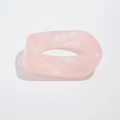 Close-up of a wide chunky pink resin bangle with white marble texture and glossy finish - Light Pink (2252)