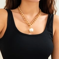 Close-up of a chunky gold chain necklace with a large pearl pendant on a model - Gold Chunky Chain Large Artificial Pearl Pendant (6310) / Gold